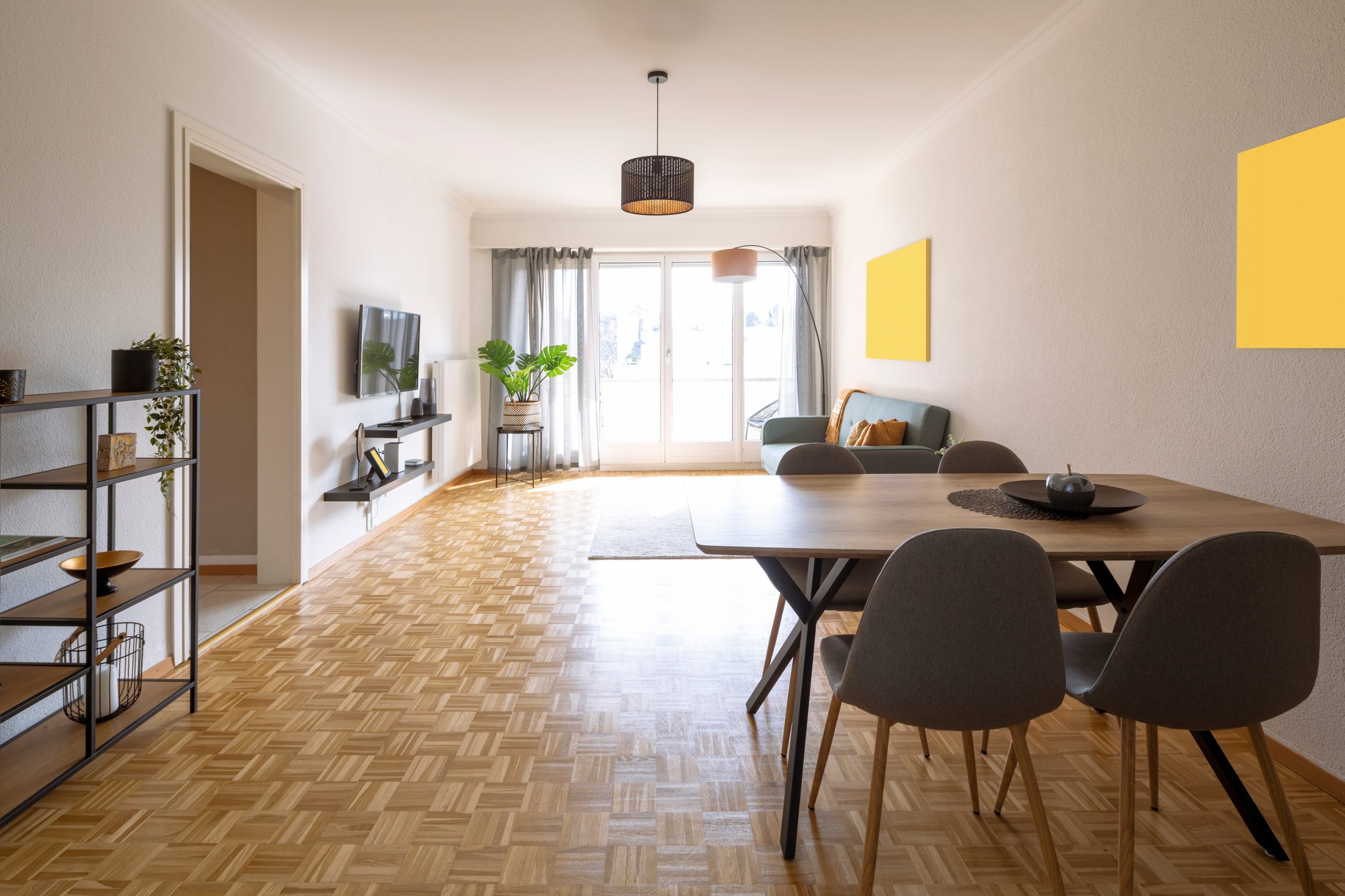 Expert Wood Floor Sanding in Hounslow—light-filled living-dining room featuring a newly restored oak mosaic parquet floor with a rich, even sheen.