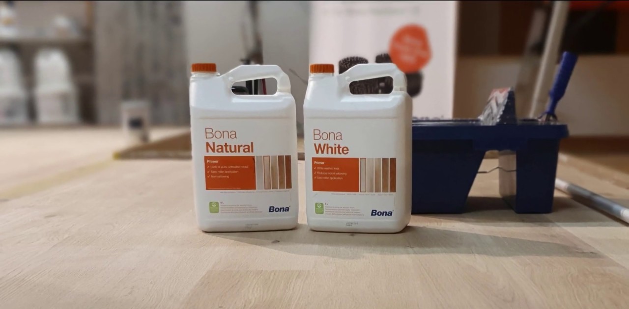 Wood Floor Sanding in Hounslow showing Bona Natural and Bona White primer bottles on freshly sanded Victorian pine softwood floorboards ready for sealing.